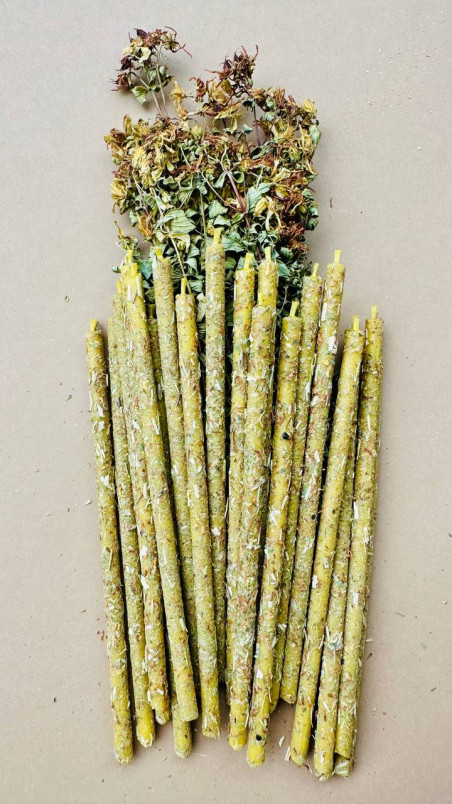 Handcrafted decorative candles made of pure beeswax, lovingly rolled in fragrant dried St. John's wort flowers.