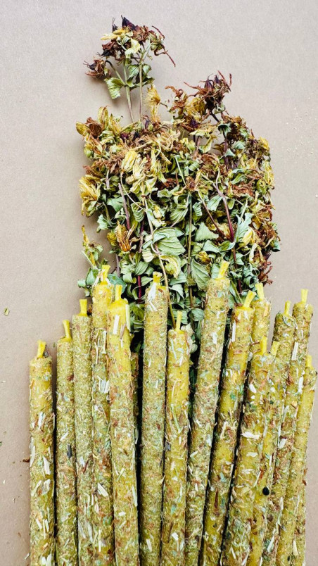 Handcrafted decorative candles made of pure beeswax, lovingly rolled in fragrant dried St. John's wort flowers.