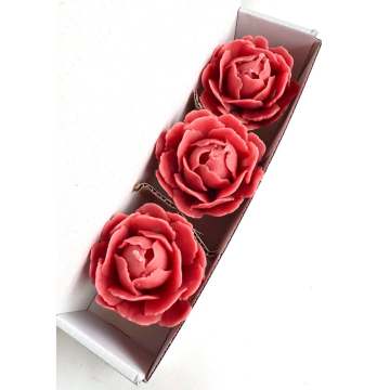 Set of three decorative candles in the shape of a peony...